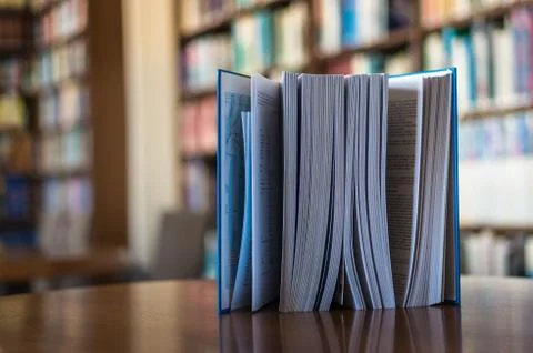 Book on the table in the library Stock Photos