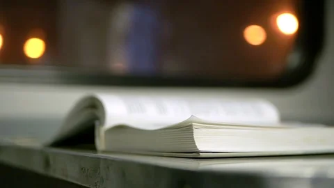 Book on the table in the train Stock Footage 104864109