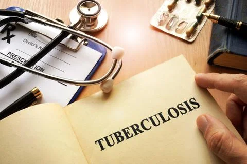 Book with title Tuberculosis on a table. Stock Photos