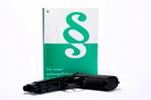 Book with weapon Stock Photos