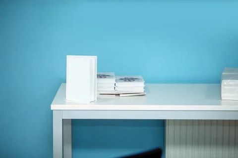 Book on a white table Stock Photos