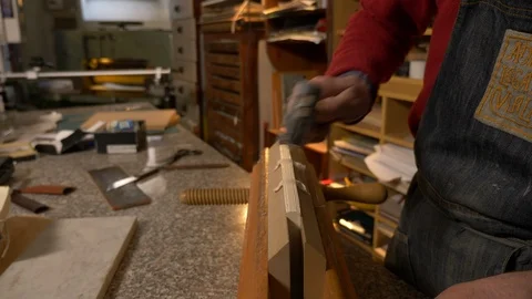 Bookbinder work on a book with hammer Stock-Footage 119421153