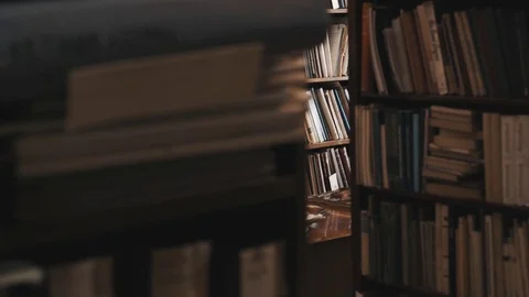 Bookcases full of books and document folders in old style library. Dolly shot Stock Footage 71927522