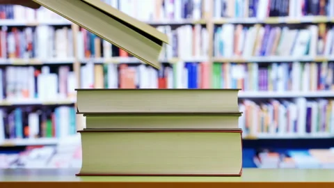 Book,hand picking up one book at library. Stockbeeldmateriaal 301067785