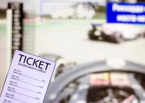 Bookmaker ticket on the background of the TV on which show the sports races the 写真素材