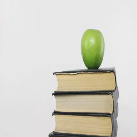 Books and Apple Rotating Stock Footage 69432372