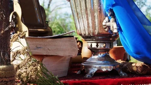 Books and the samovar standing on the table Video stock 83000419