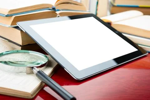 Books and tablet pc Stock Photos