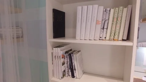 The books are on the shelf. Stock Footage 79195911