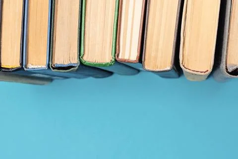Books on the blue background Stock Photos