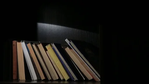 Books on a bookshelf Stock Footage 71357850