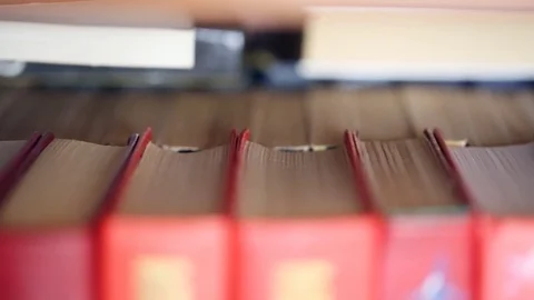 Books on bookshelf 스톡 동영상 81249606