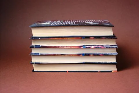 Books on brown background Stock Photos