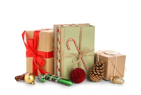 Books with candy cane, gift boxes and Christmas balls on white background Stock Photos