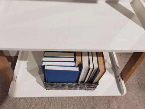 Books close at hand under the table Stock Photos