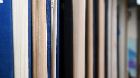 Books close-up on the shelf. Видео 223687837