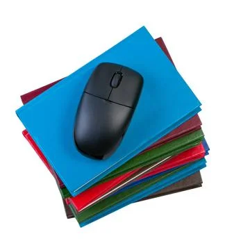 Books with computer mouse isolated on white background. Books with compute... Stock Photos