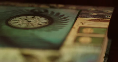 A book's cover lying on a table, close up focus pull Stock Footage 150384044