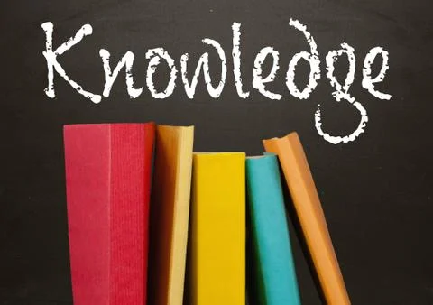 Books in foreground with blackboard text of knowledge Foto stock
