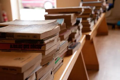 Books on foreground in the image Stock Photos