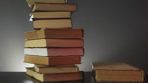Books gradually appear in the frame, a stack of books, a lot of books, old books Stock Footage 264093960