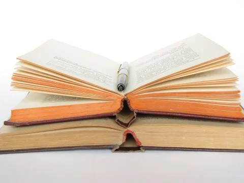 Books, knowledge, feather, is isolated. Stock Photos