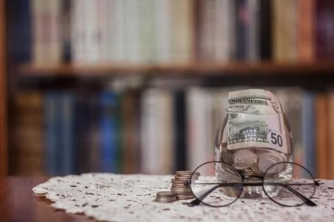 The books in the library on the table.To gain knowledge from the Stock Photos