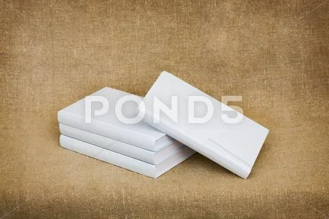 Books with light covers against a sacking Stock Photos