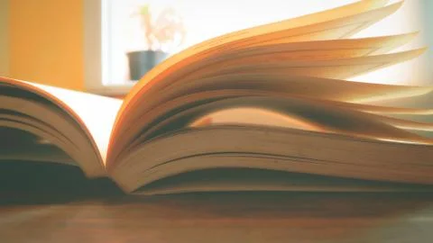 A books opened on desk Stock Photos