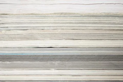 Books or magazines stack texture close up, abstract layered backdrop Foto stock