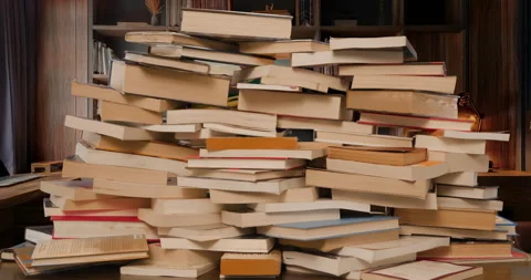 Books Pile Build Stop Motion Loop in Office Wide Stock Footage 297720607