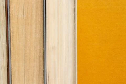 Books placed vertically with spines inward, edges of pages of different sha.. Stock Photos
