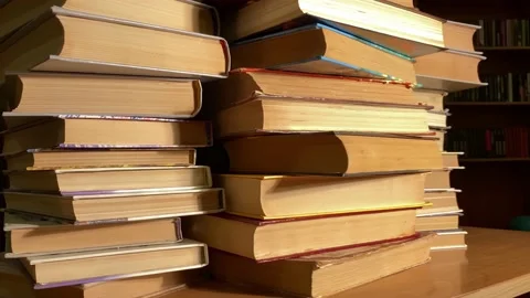 Books rotating on desk in library 動画素材 182337918