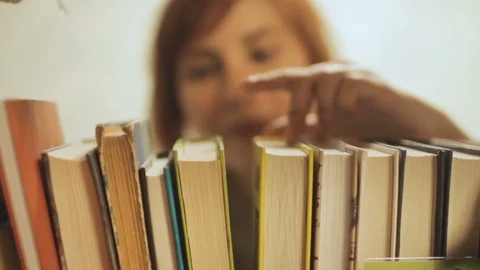 Books on shelf Stock Footage 85604785
