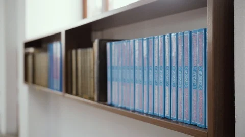 Books on the shelf in the mosque Stock Footage 85594532