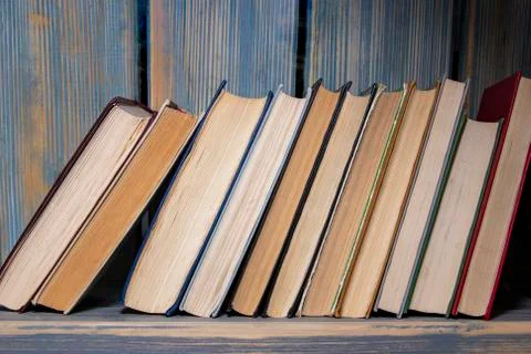 Books on the shelf. Stock Photos