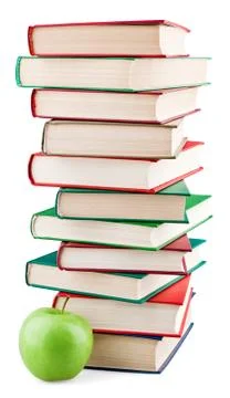 Books stack and green apple Stock Photos