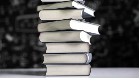 Books stack up stop motion time lapse on backboard background Stock Footage 160522929