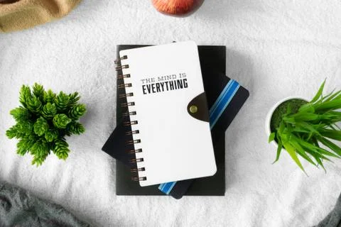Books stack on table with white tablecloth Stock Photos