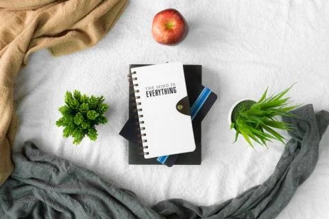 Books stack on table with white tablecloth Stock Photos