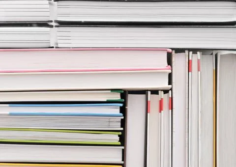 Books stacked in a pattern. background for back to school concept. pile of Stock Photos
