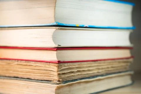 Books stacked on the table Stock Photos