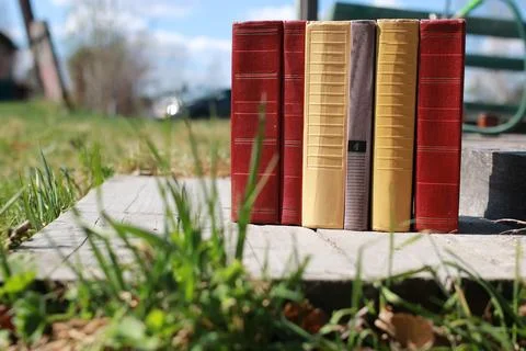 Books standing on a table Stock Photos