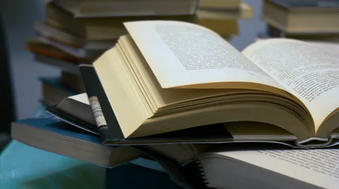 Books on the table dolly shot Video stock 43130800