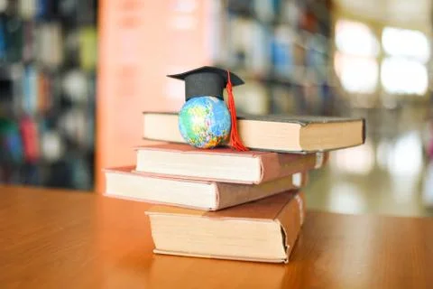 Books on the table in the library - Education learning old book stack and gra Foto stock