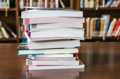 Books on the table in the library Stock Photos