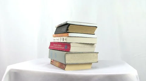 Books on the table. Stack of books. Stock-Footage 1883433