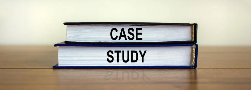 Books with text 'case study' on beautiful wooden table. White background. Bus 写真素材