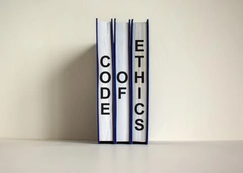 Books with text 'code of ethics' on beautiful white background. Business conc Stock Photos