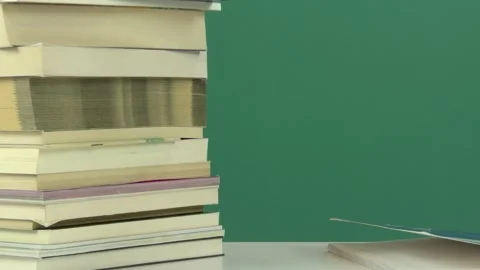 Books waiting at the library's desk Vídeos de archivo 344586534